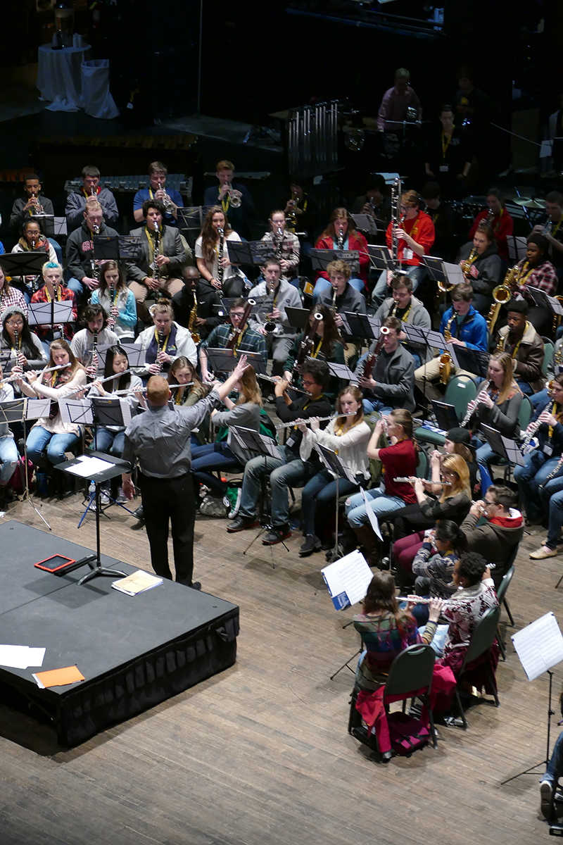 Scott Pannell, assistant director of bands for North Cobb High School, conducts high school musicians Jan. 22 as part of the UGA Hugh Hodgson School of Music's JanFest event at the Classic Center.	