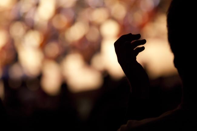 Audience member clapping