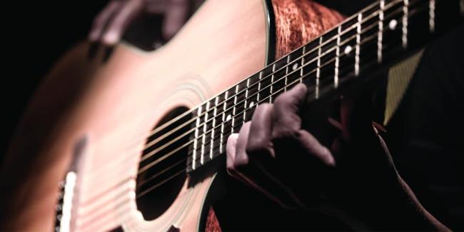 Person playing guitar.