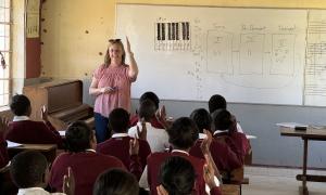 Emily Gertsch, senior lecturer in music theory, teaches a beginning music theory course at a school in Kenya during the trip March 7-11, 2024.