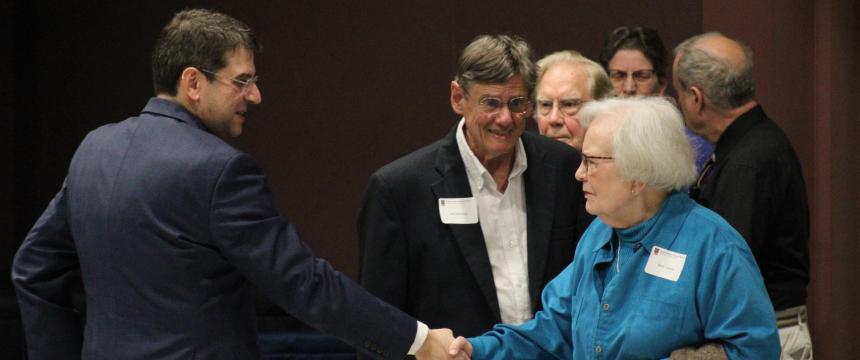 Director Peter Jutras (left) greets HHSOM donors. (Photos by Easel Images)
