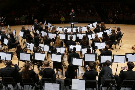 Jaclyn Hartenberger conducts the UGA Wind Symphony during a performance in Hodgson Concert Hall at the UGA Performing Arts Center on September 19.