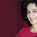 Shakhida Azimkhojaeva, academic professional, violin with a purple curtain background