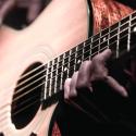 Person playing guitar.